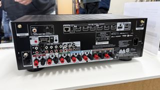 The Denon AVR-X2900H's rear panel, showing a large array of connections in and out