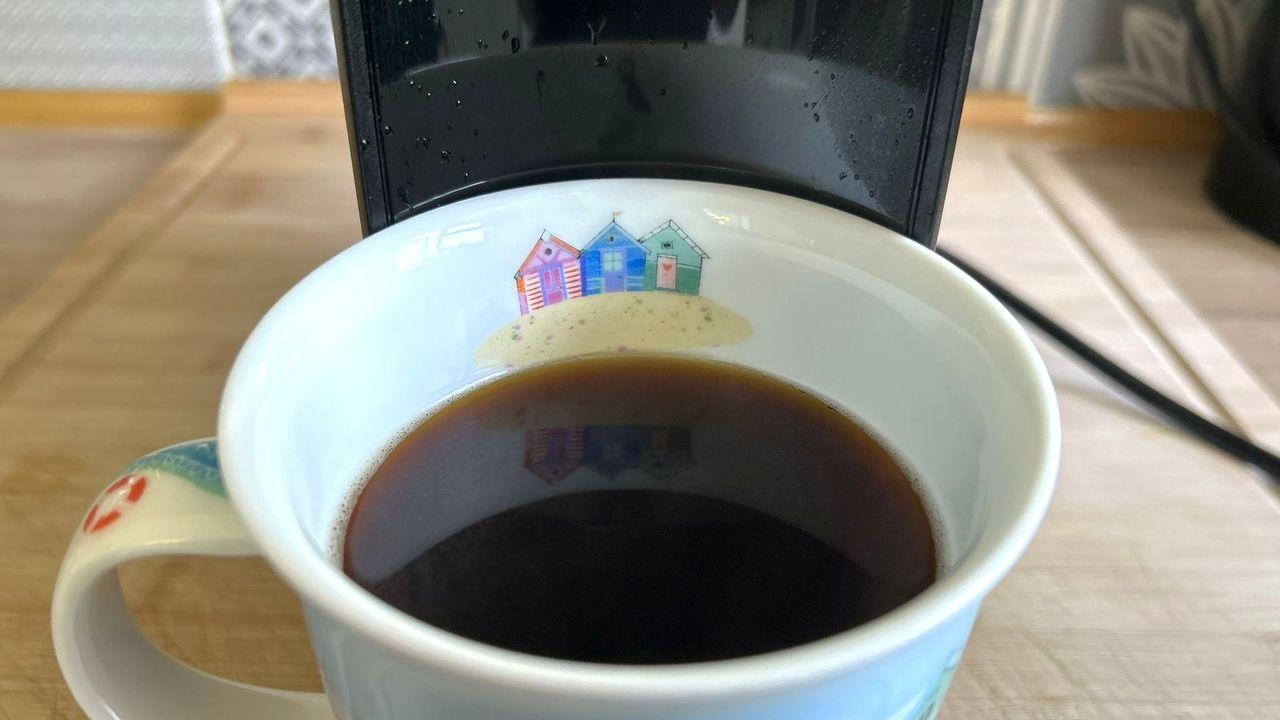 Mug full of coffee brewed using Keurig K-Mini Mate coffee maker