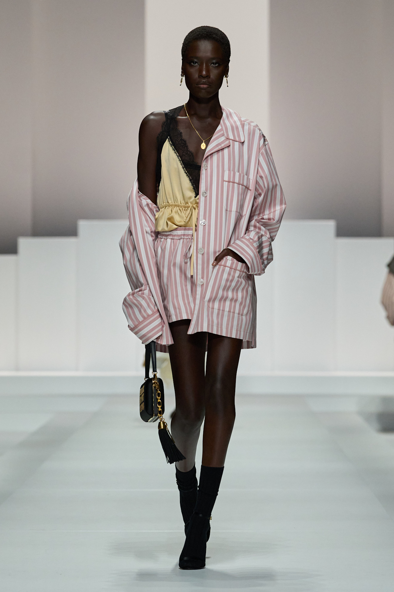 Women on dolce &amp;amp; Gabbana runway show wearing pajama-inspired outfits.
