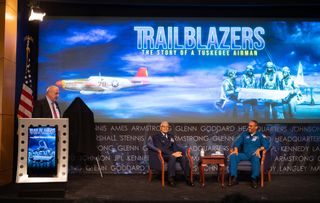 Robert Pearce, associate administrator for NASA's Aeronautics Research Mission Directorate (left), moderates questions from the audience during an event honoring retired U.S. Air Force Honorary Brig. Gen. Charles McGee (center) at NASA Headquarters in Washington on Feb. 5, 2020. Seated next to him is NASA astronaut Alvin Drew.