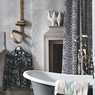 bathroom with snakeskin wallpaper and leopard print curtain