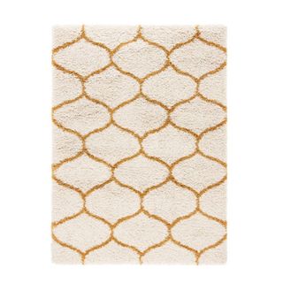 A white and gold geometric rug