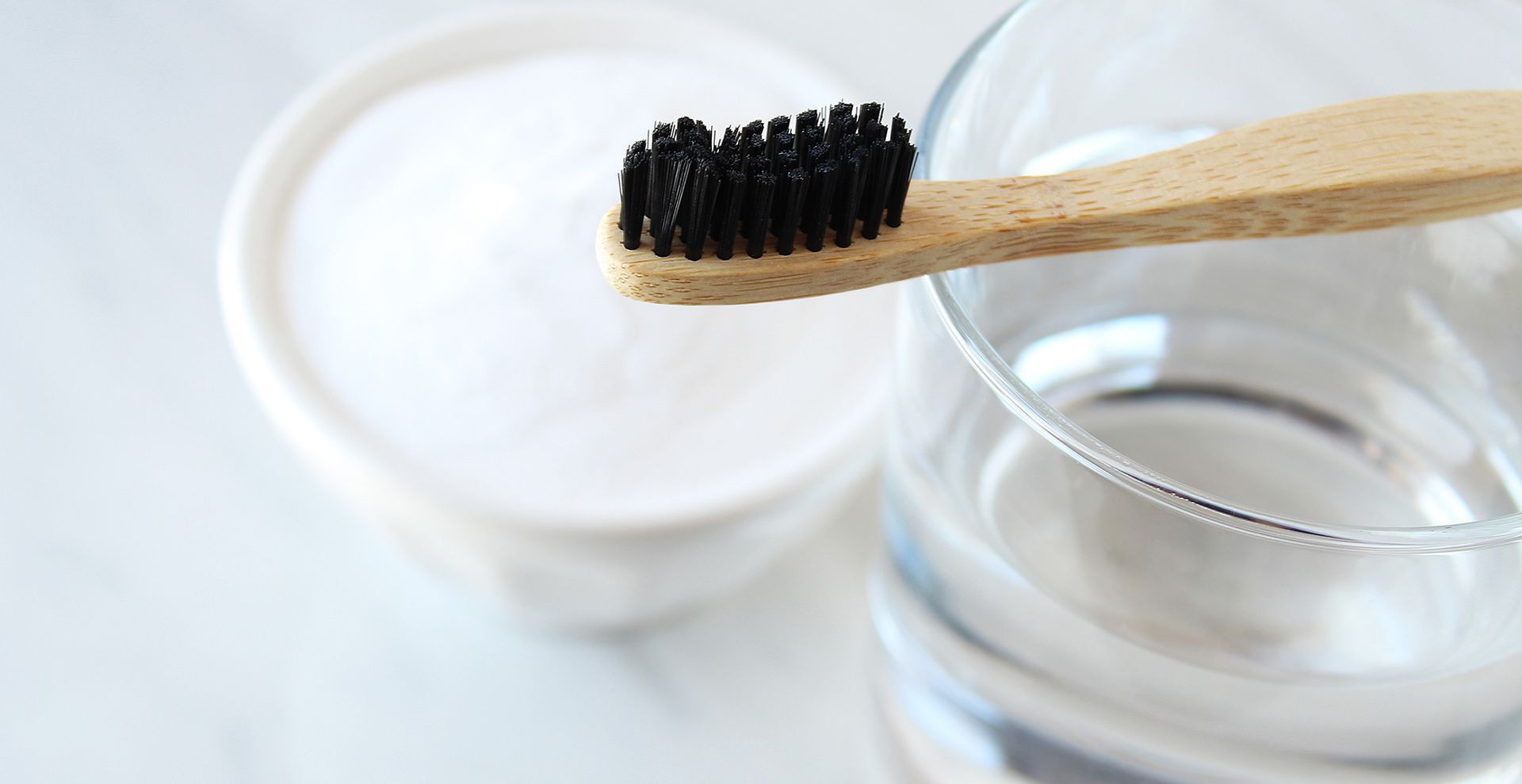 baking soda being mixed with water to form a paste to show how to clean an iron with burnt matter