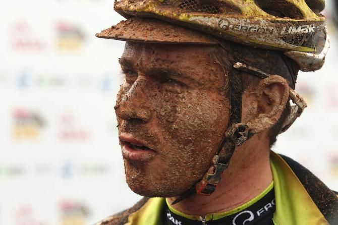 A muddy Robert Mennen of Topeak-Ergon Racing