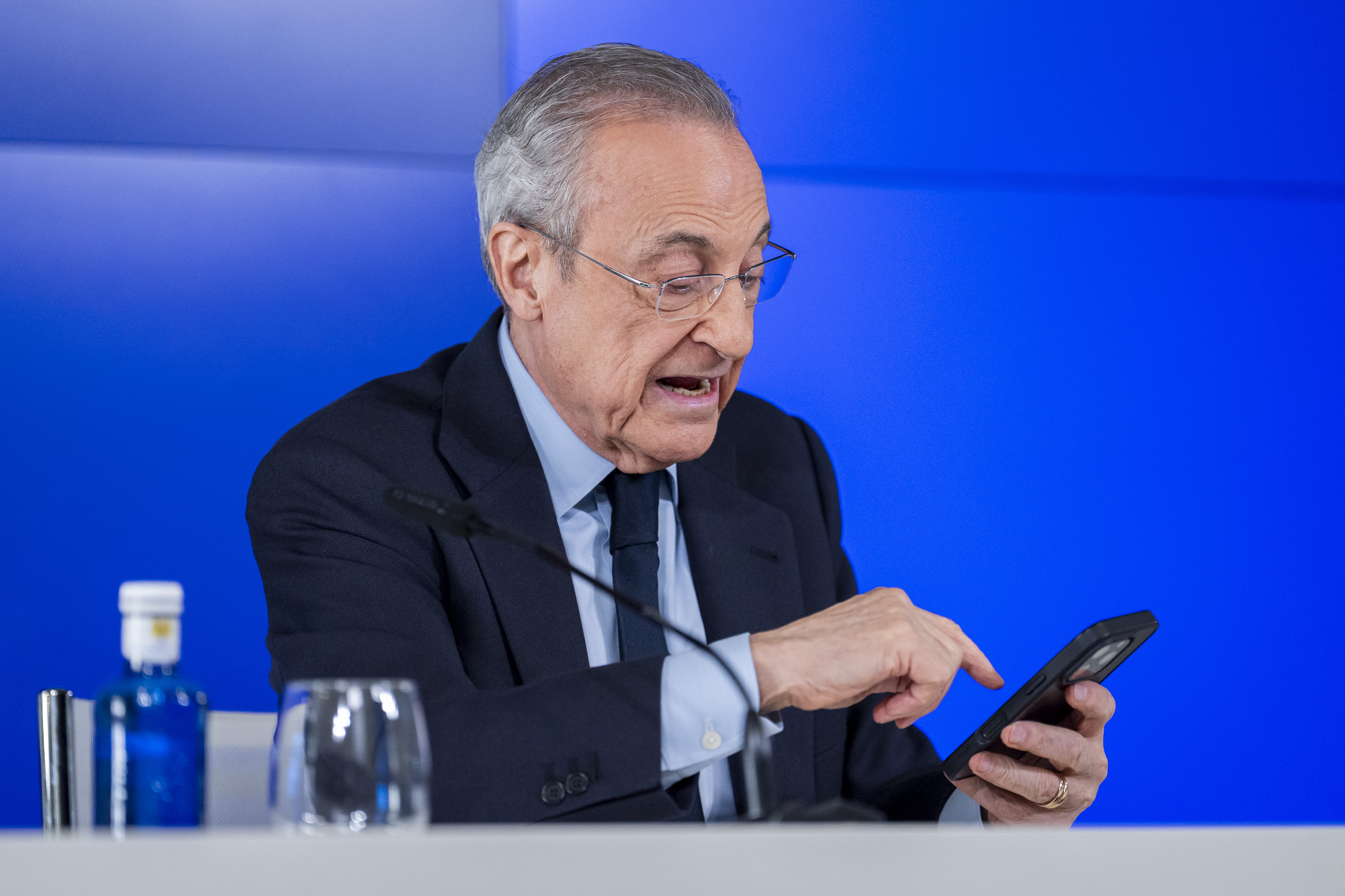 Florentino Perez, President of Real Madrid, looks at his phone during a press conference at Ciudad Real Madrid in Madrid, Spain, on May 12, 2026. (Photo by Alberto Gardin/NurPhoto)