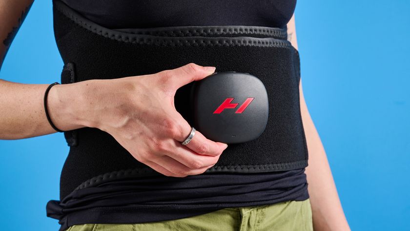 Hyperice Venom 2 Back being worn by a woman photographed in front of a ble background