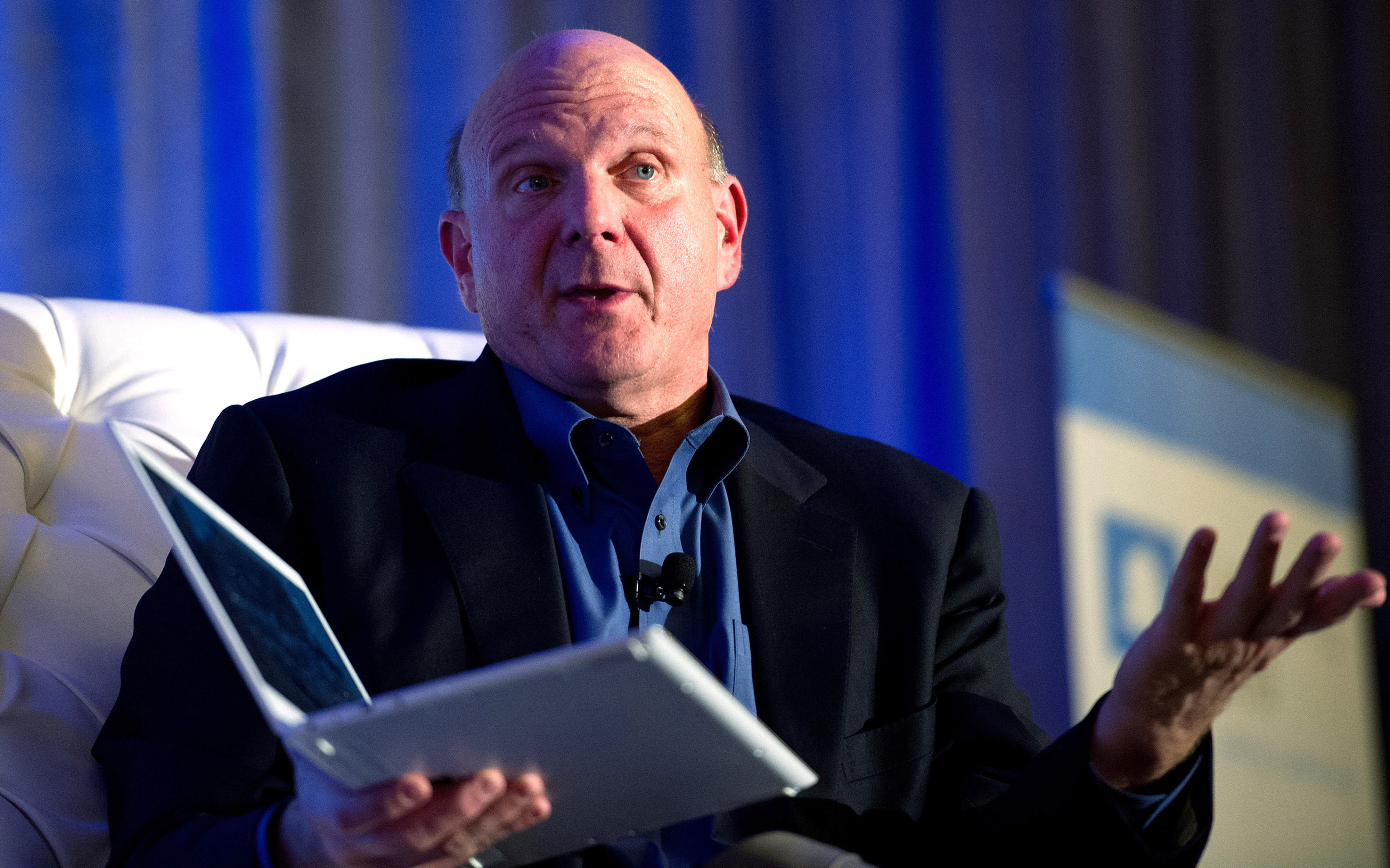 Steve Ballmer holding a Windows 8 laptop