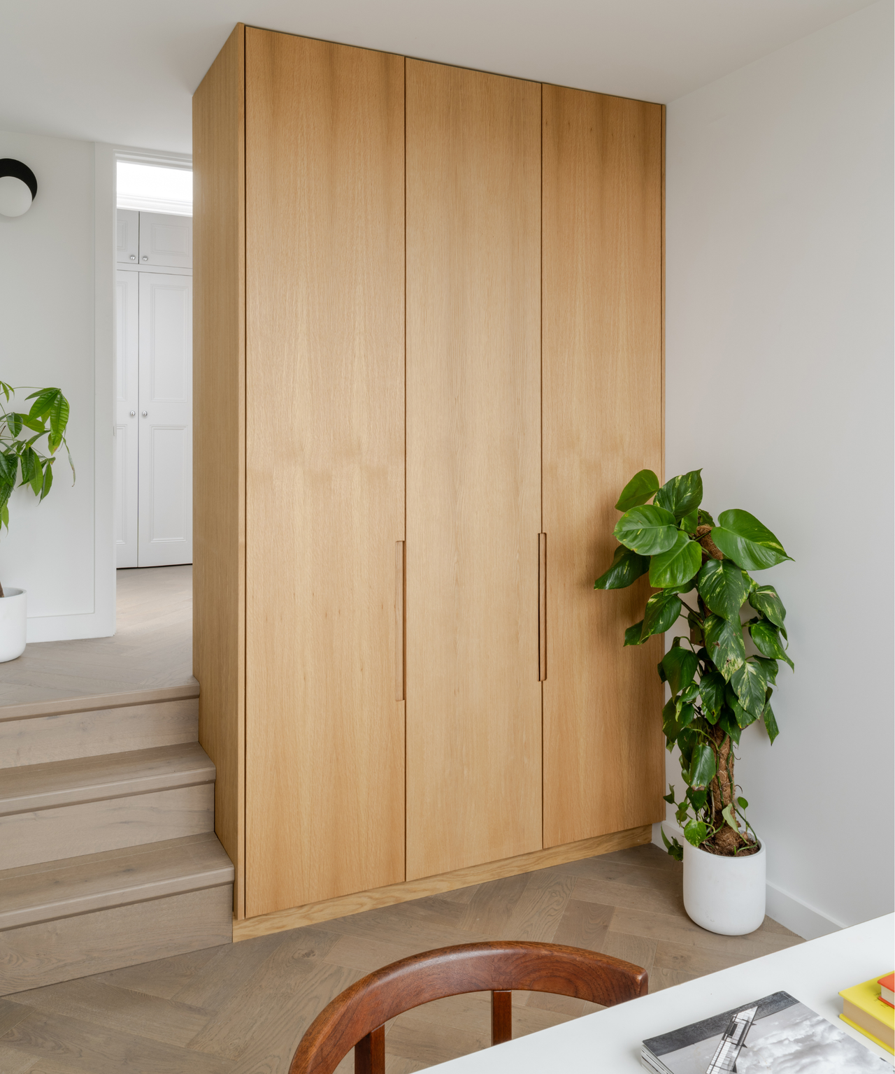 wooden wardrobe with steps on left hand side