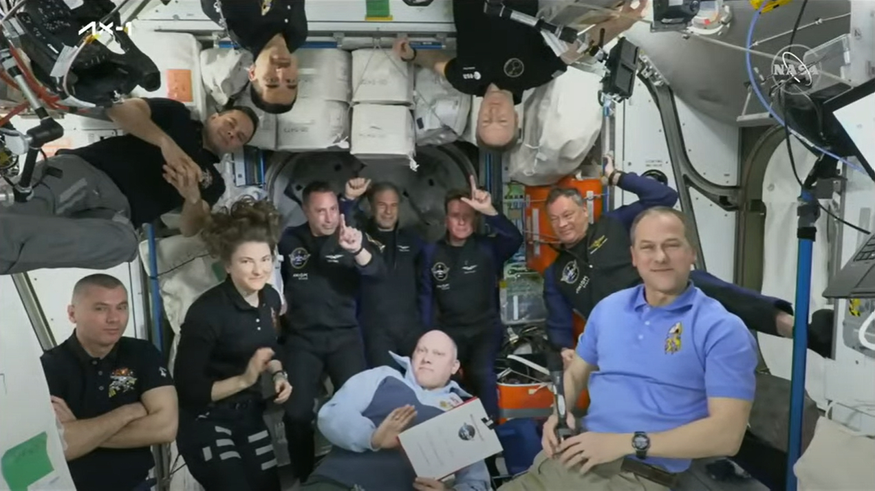 SpaceX's Ax-1 private astronauts make a number one gesture for their flight after joining the Expedition 67 crew on the International Space Station and getting their astronaut wings on April 9, 2022.