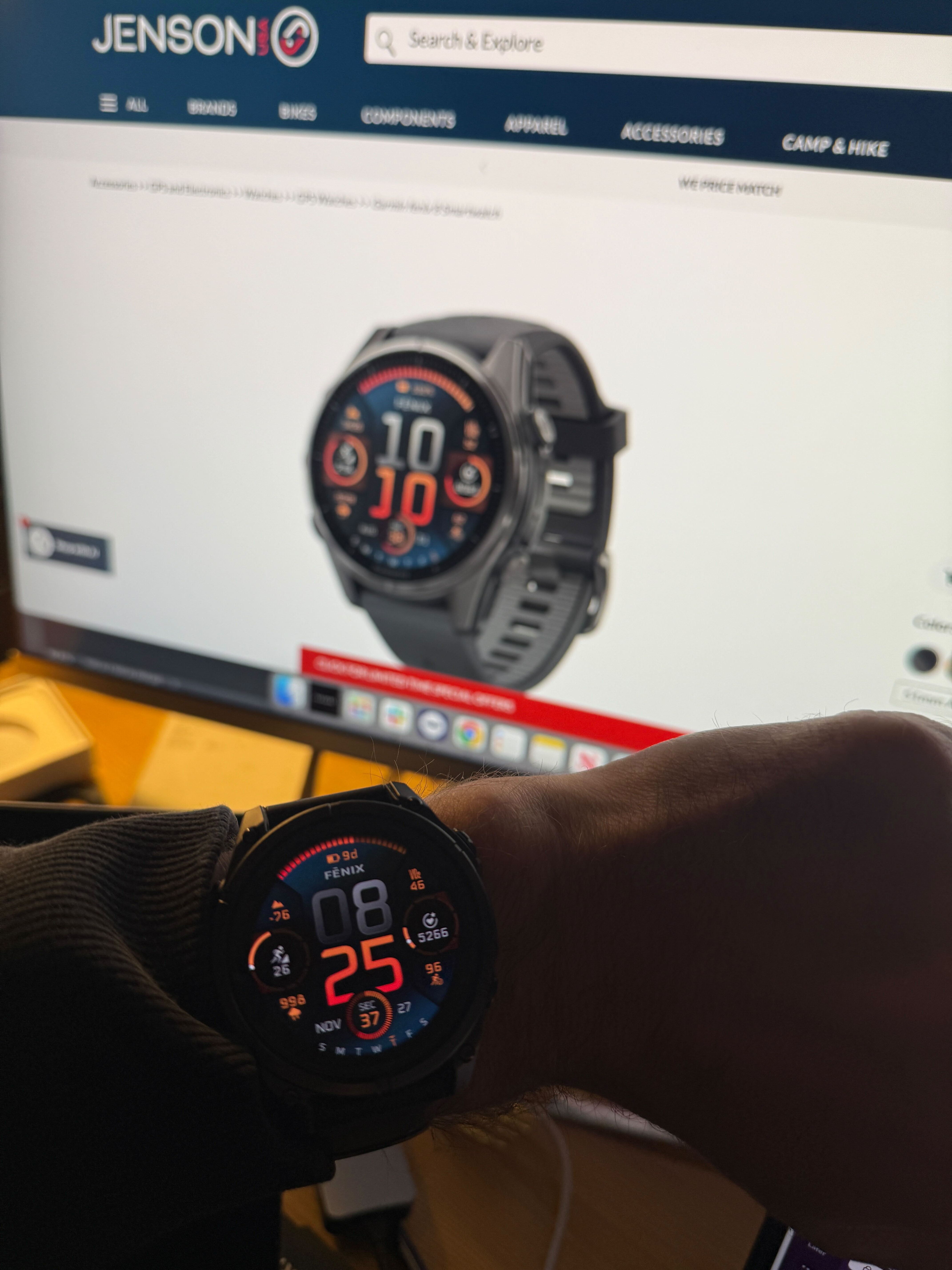Andy wearing a Garmin Fenix 8 in front of a screen with a picture of a Garmin Fenix 8