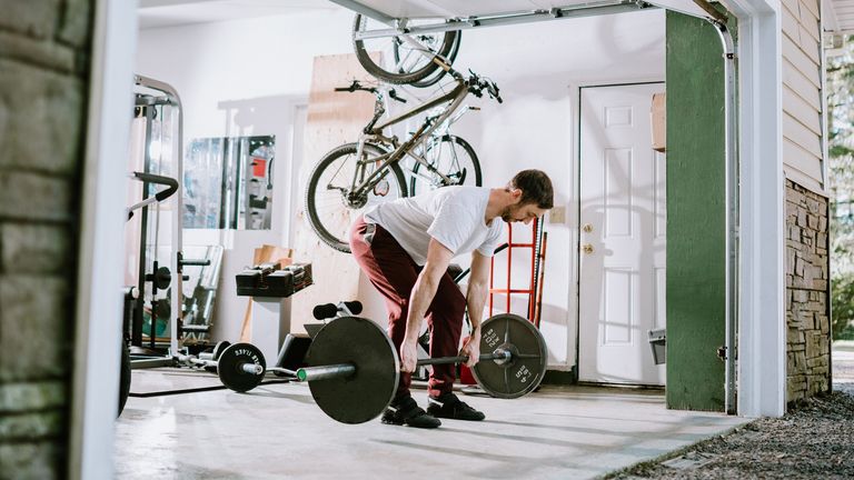 Man lifting in his home gym
