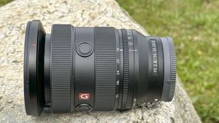 Sony FE 16-35mm F2.8 GM II lens outdoors on a rock