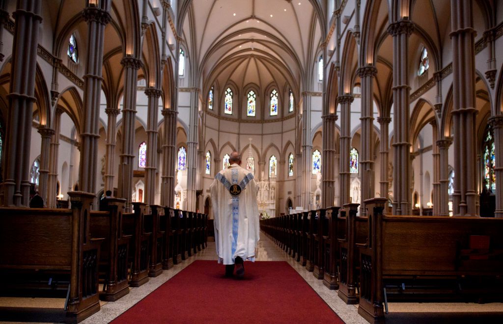 A Catholic priest in his church.