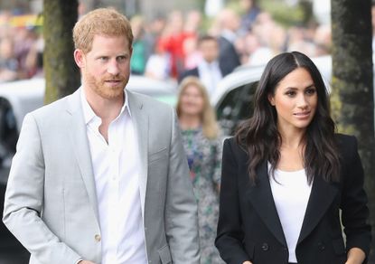 Prince Harry, Duke of Sussex and Meghan, Duchess of Sussex arrive at the Famine Memorial