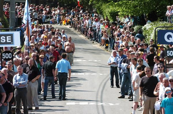 Spectators await the peloton to ascend the Mur de Huy.