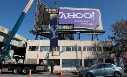 Workers dismantle a San Francisco Yahoo! billboard