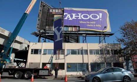 Workers dismantle a San Francisco Yahoo! billboard