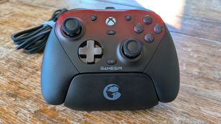 The GameSir G7 Pro gamepad sitting in its charging dock