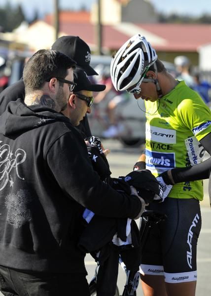 Sprint jersey wearer Roman Van Uden of Pure Black Racing gets a last-minute radio check.
