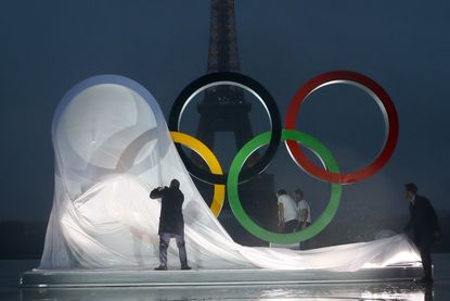 Paris unveils a display of the Olympics rings in front of the Eiffel Tower.