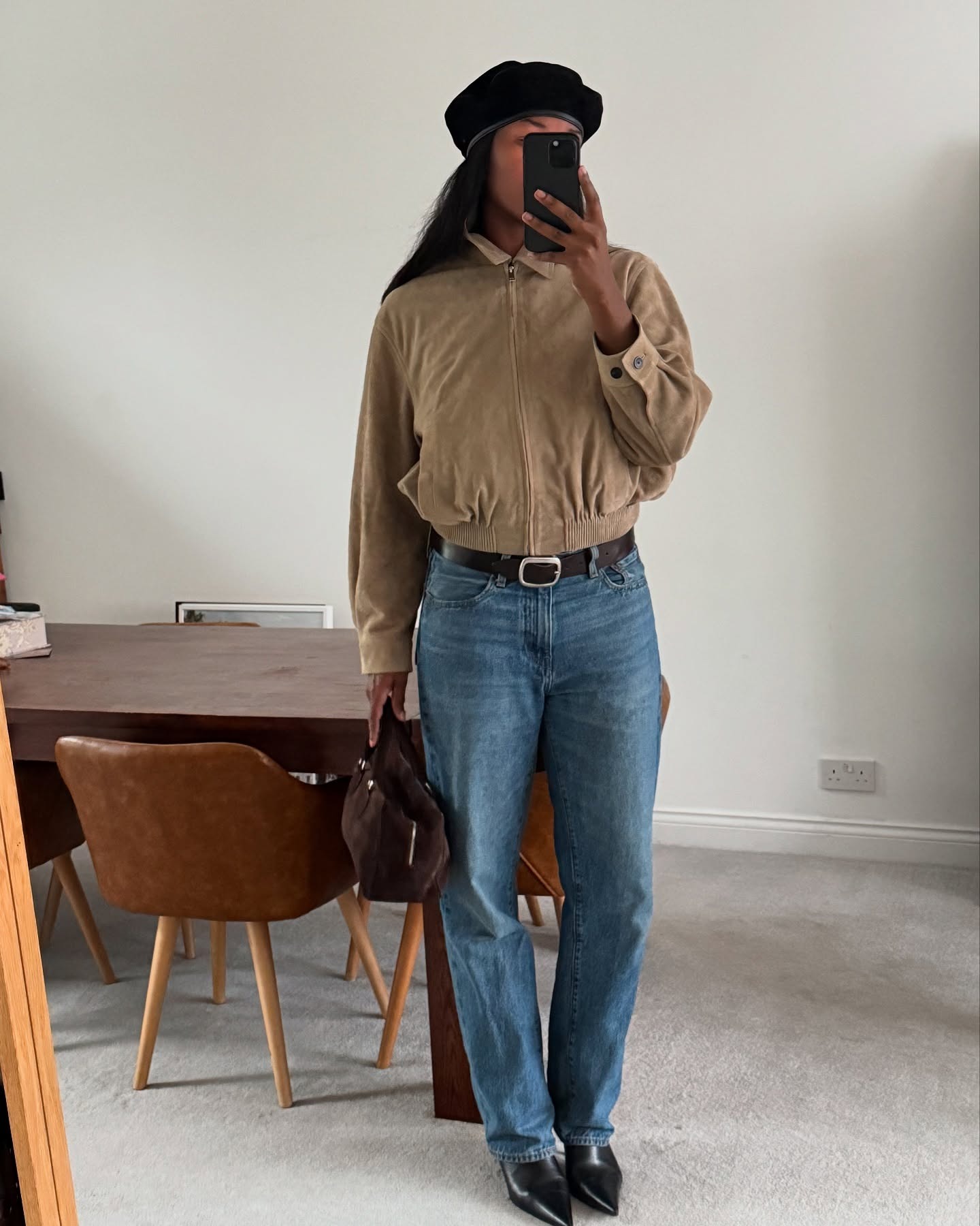 Fashion person Marylin wears a London capsule wardrobe piece. She wears straight leg jeans
