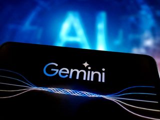 Google Gemini Pro logo displayed on a smartphone with &#039;AI&#039; lettering shown in background