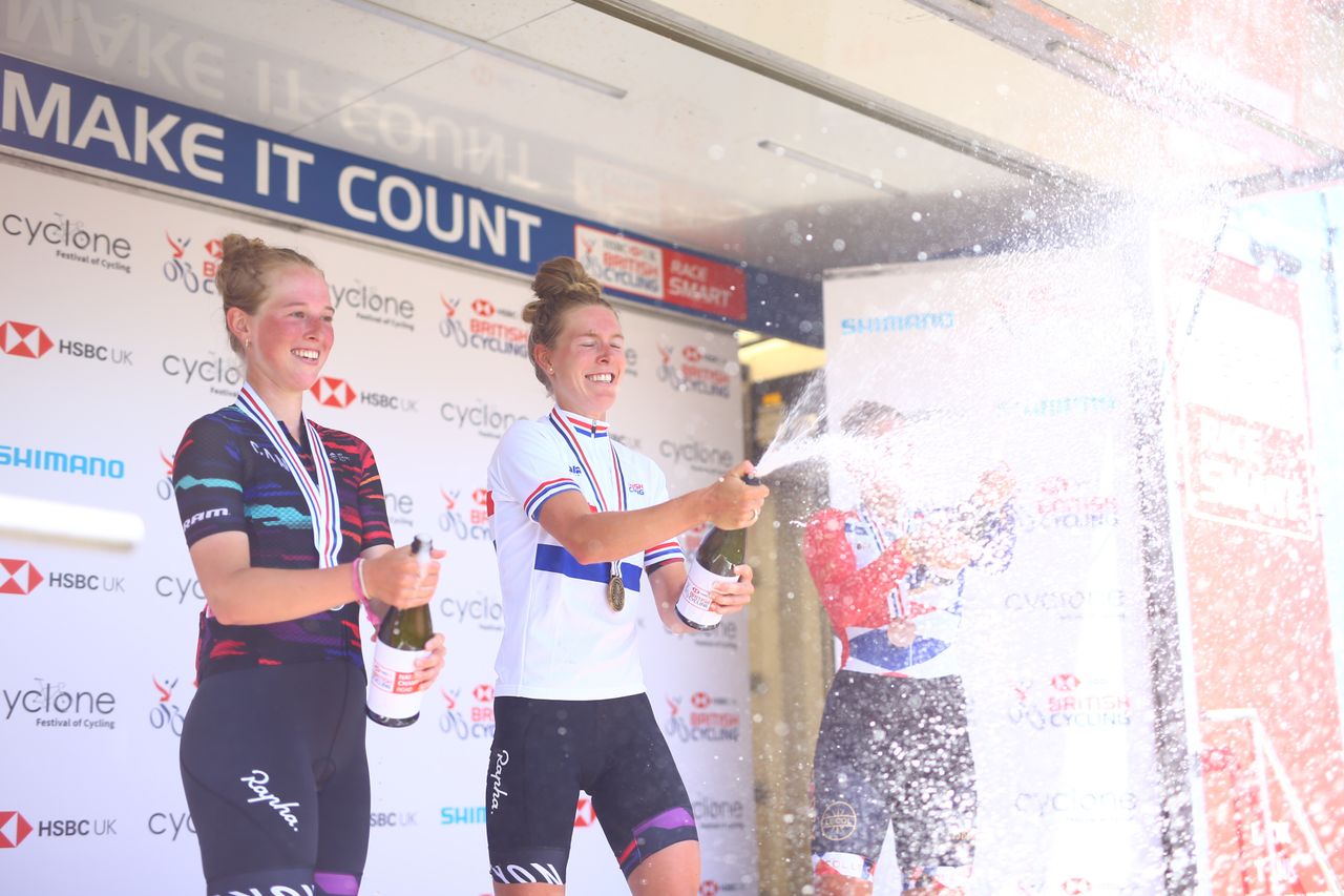 The riders spray the champagne