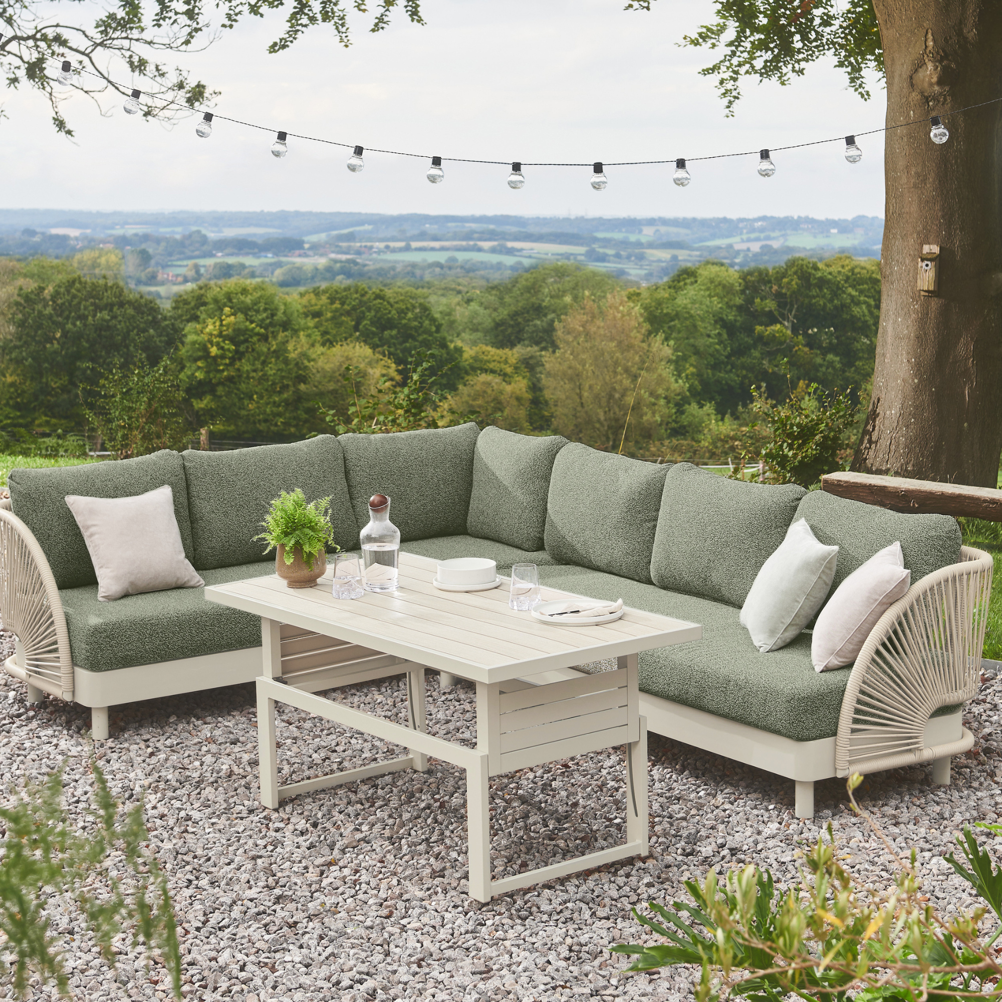 outdoor corner sofa in beautiful garden with view 
