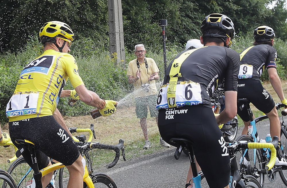 Chris Froome celebrates with his Team Sky teammates on the final Tour de France stage