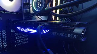 Nvidia GeForce RTX 4070 Super installed within case with Zotac Gaming logo illuminated