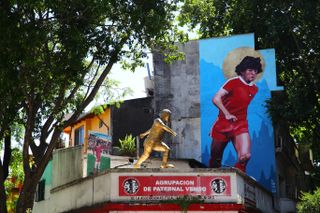 A mural and a statue of Diego Maradona outside Argentinos Juniors' stadium, pictured in November 2018.