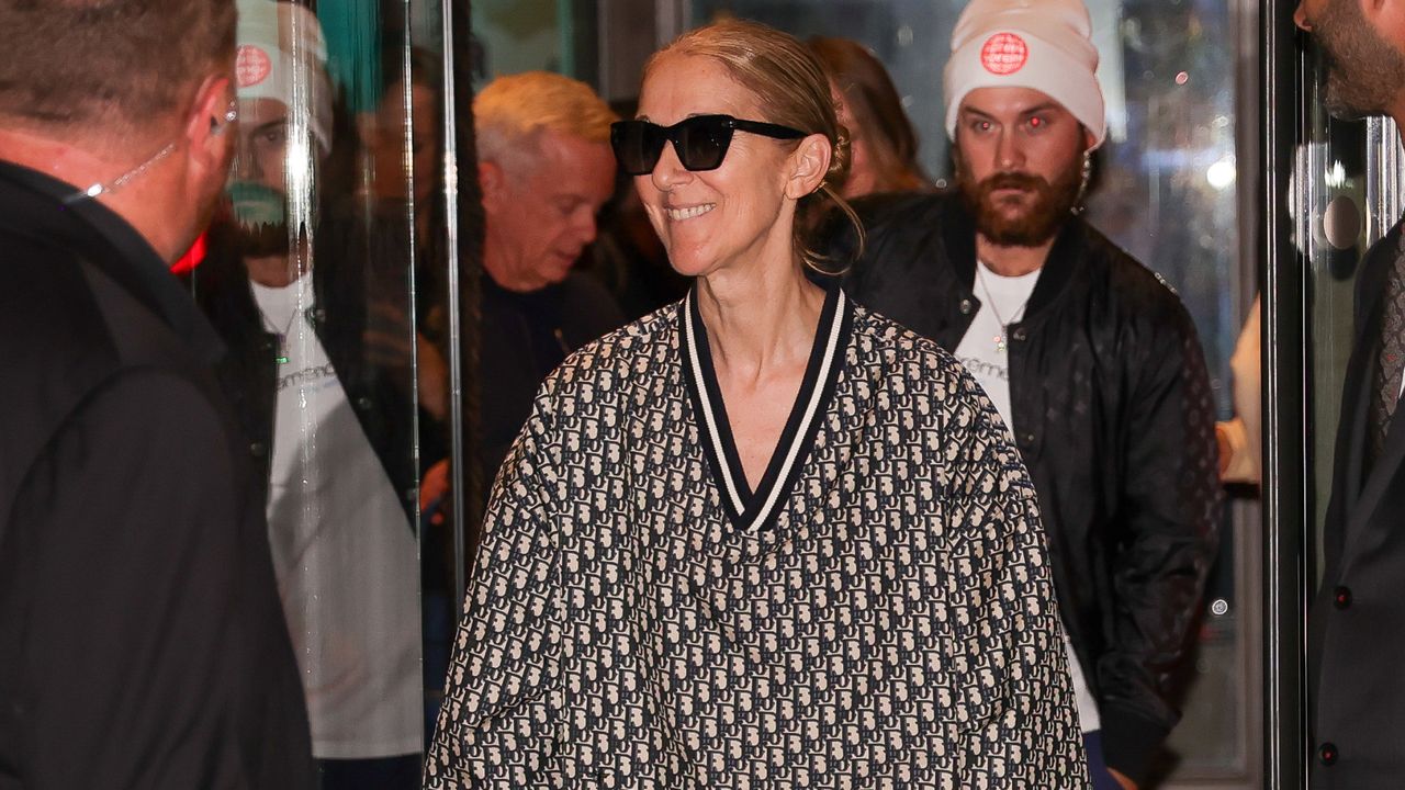 celine dion wears a dior logo track suit ahead of her olympics performance