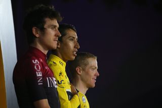 Egan Bernal (Team Ineos) stands between Geraint Thomas and Steven Kruijswijk