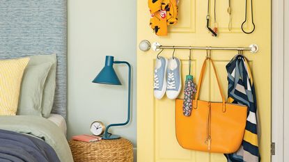 bedroom with door storage and bedside table with lamp