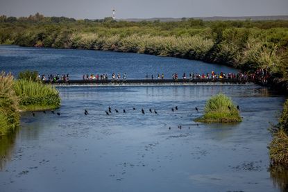 Migrants across Rio Grande.