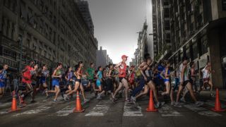 People running a marathon on city streets