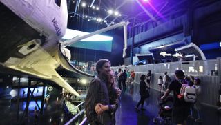 Grace Potter keyboard player Eliza Hardy Jones and friend at Space Shuttle Atlantis exhibit at NASA's Kennedy Space Center.