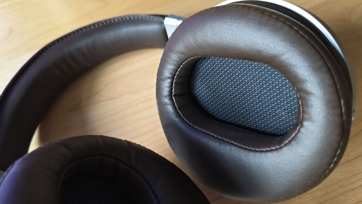 The Denon AH-D5200 and other headphones, photographed on a home desktop.