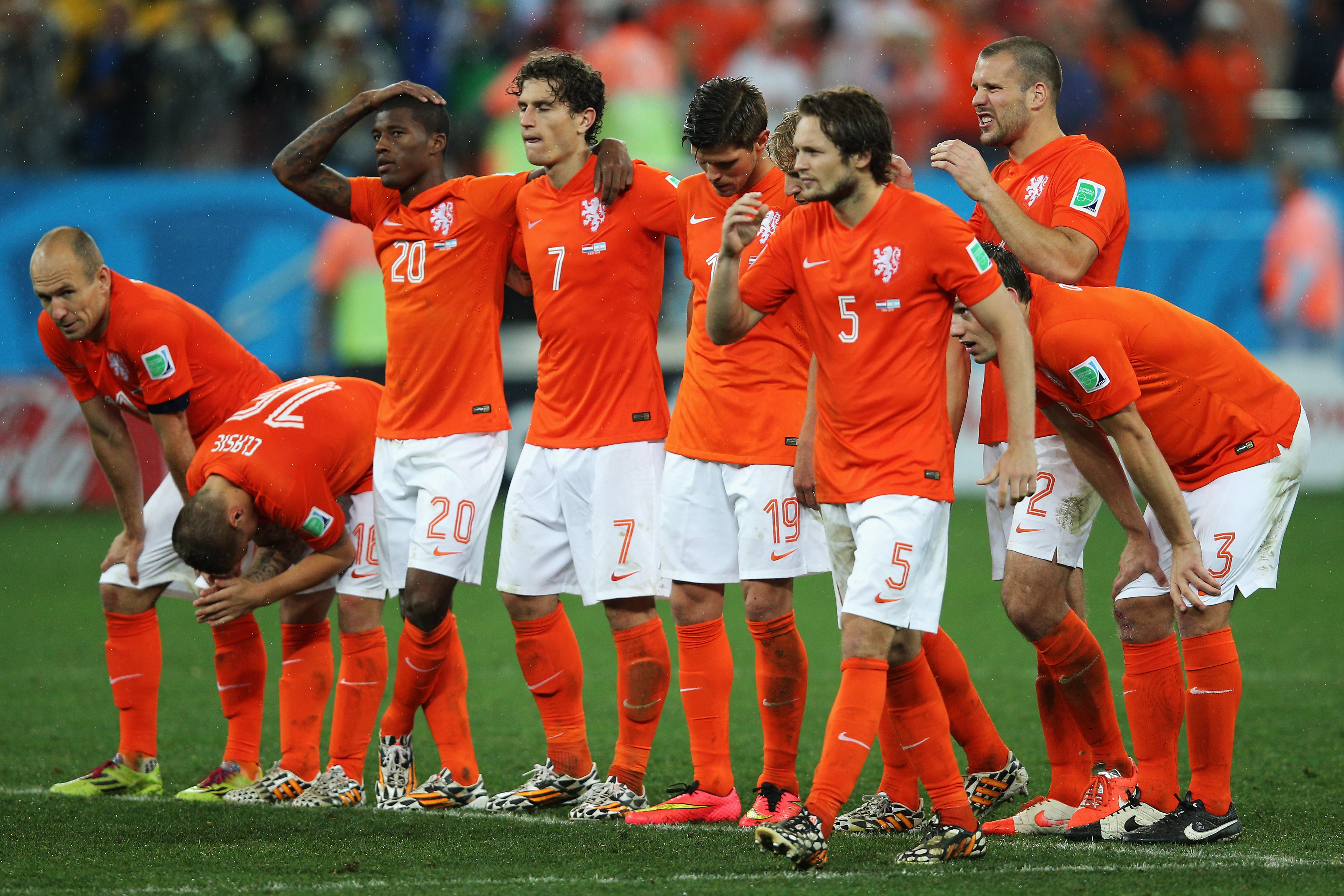 Netherlands players react to defeat on penalties against Argentina in the 2014 World Cup semi-finals.