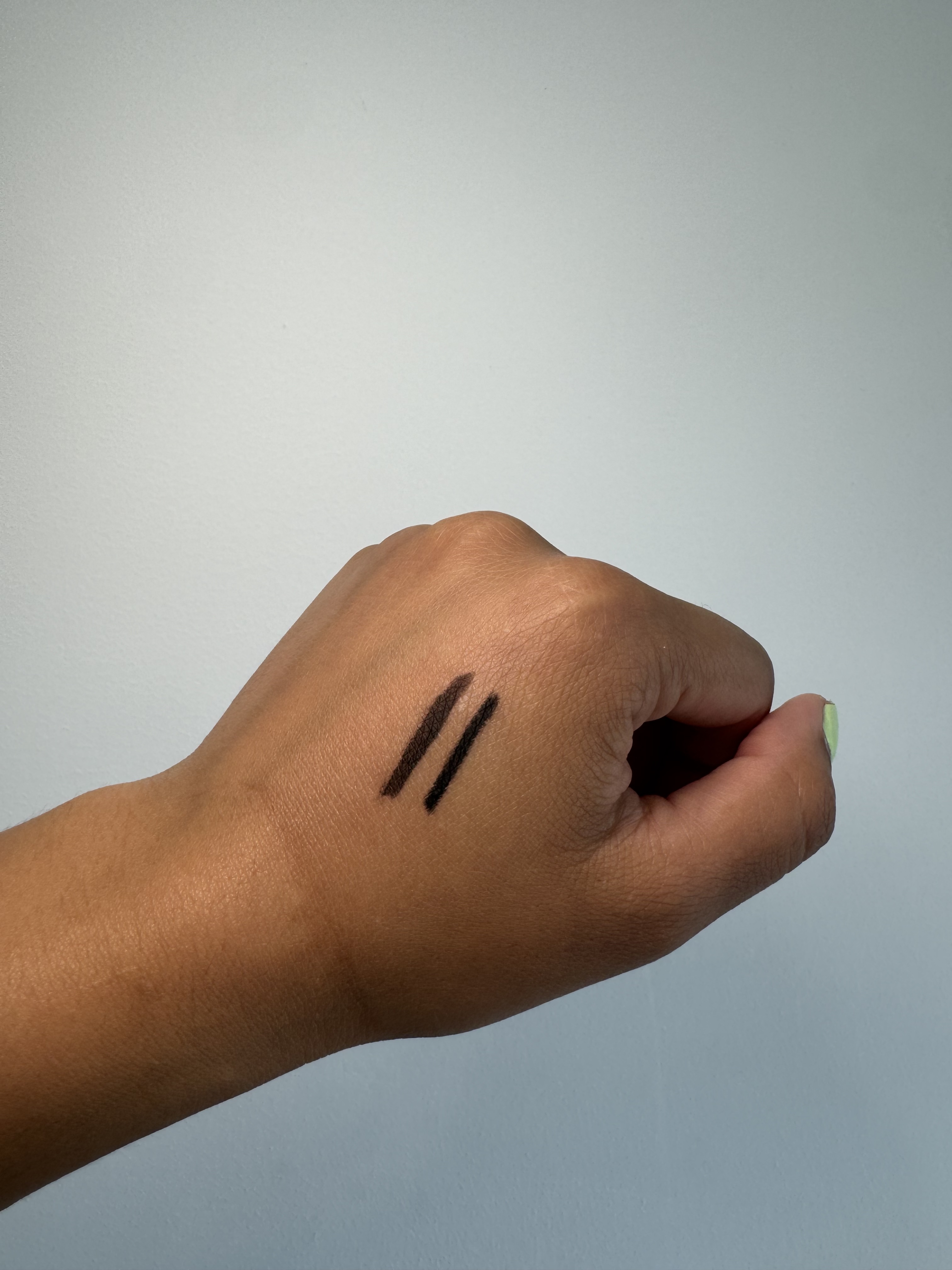 Charlotte Tilbury Rock 'N' Kohl Eyeliner Pencil black and brown swatches on back of hand