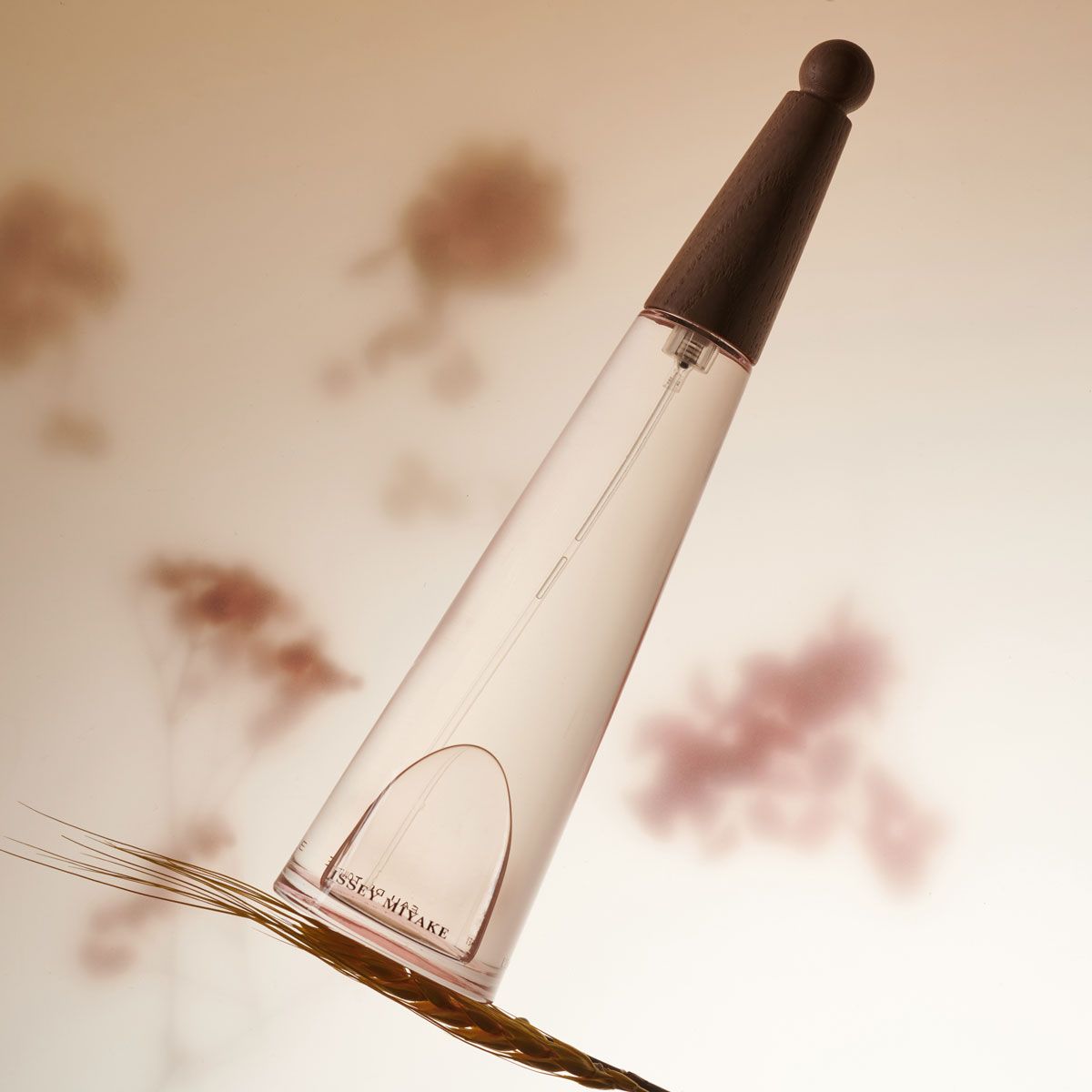 Issey Miyake L'Eau D'Issey Pivione Eau de Toilette Intense floral perfume shot on a wheat sheaf