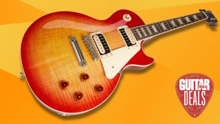 A Gibson Les Paul electric guitar on an orange background