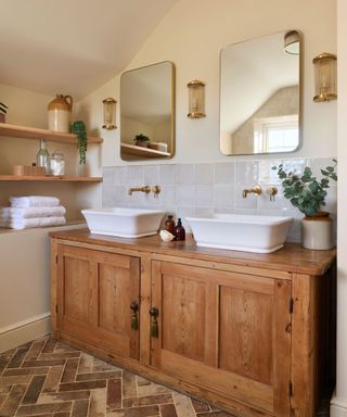 Bathroom with sinks mounted on a vintage pine dresser base