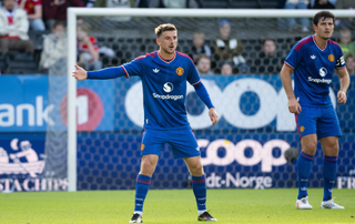 Mason Mount and Harry Maguire of Manchester United in action during the pre-season friendly match between Rosenborg and Manchester United at Lerkendal Stadion on July 24, 2026 in Trondheim, Norway.