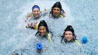 The cast of Avatar 2, including Kate Winslet, Zoe Saldana and Sam Worthington, floating in a pool dressed in CGI suits