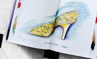 Sketch of evening shoes embellished with golden pheasant feathers.