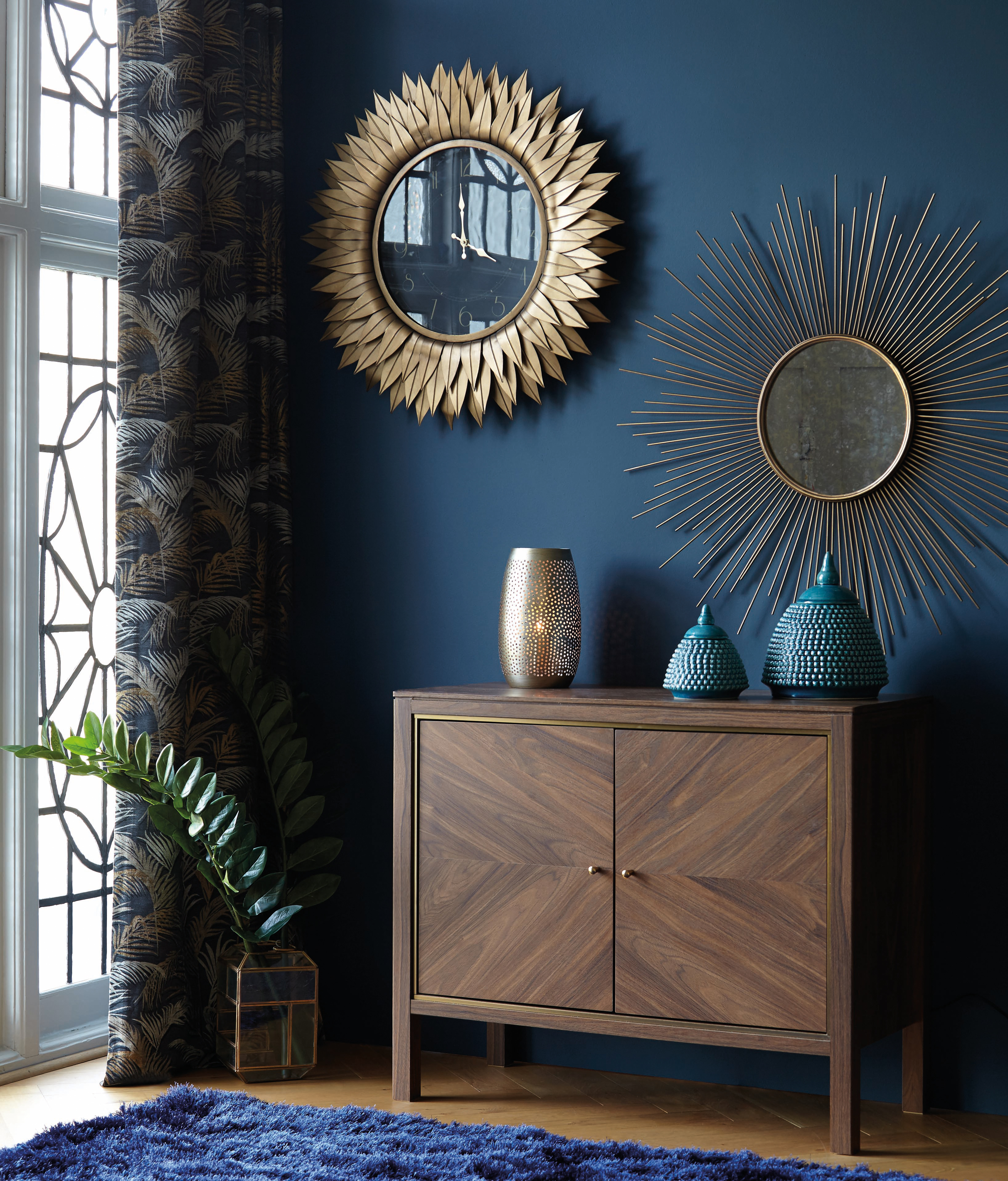 Starburst mirrors and clock in mid-century modern living room