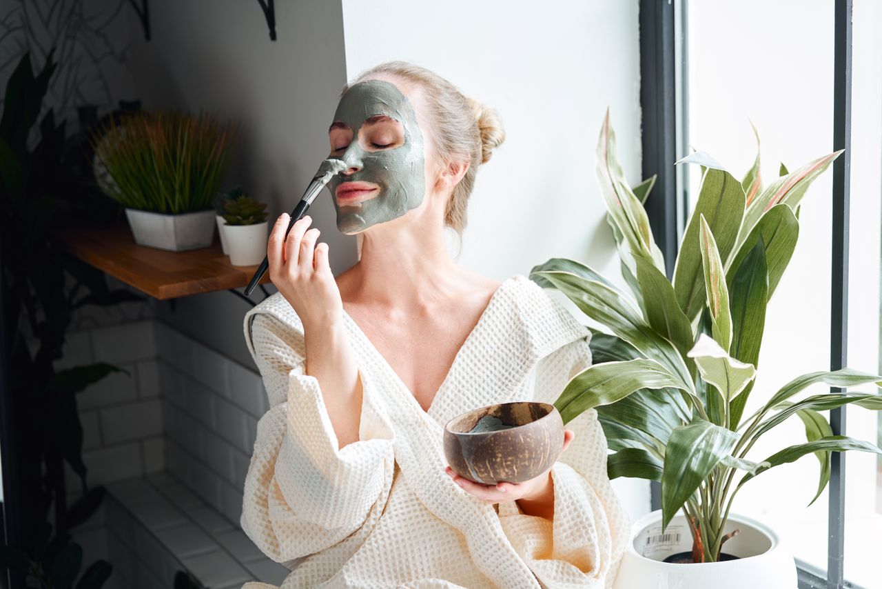 Woman enjoying skin care treatment at home