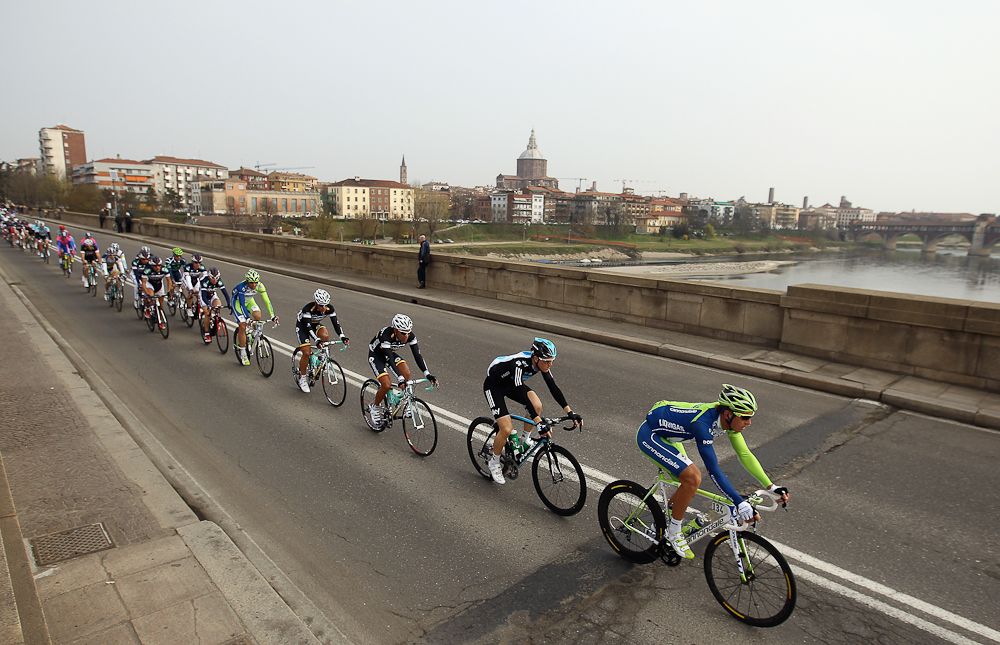 The peloton rides over a bridge during the 2012 Milan San Remo