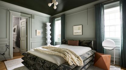 a modern sage green bedroom 